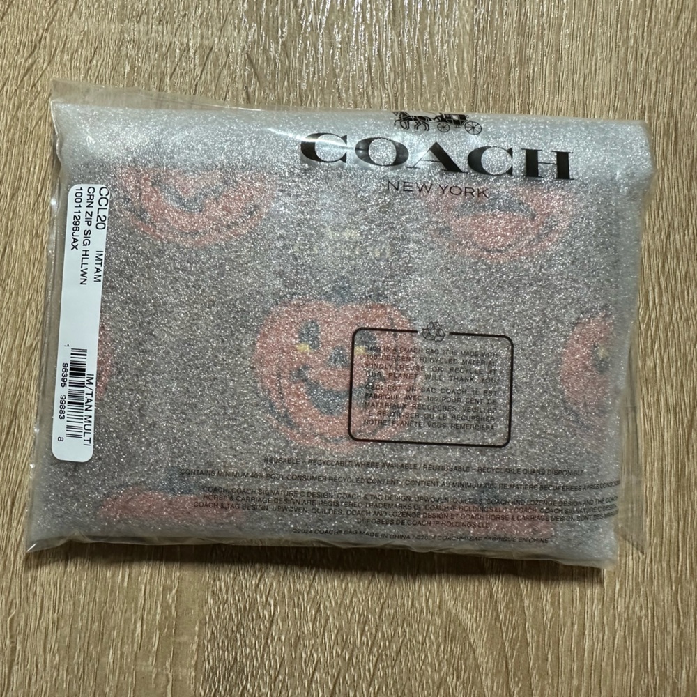 Coach CornerZip Wristlet Signature Canvas and Halloween Print 2025 Brown/Orange